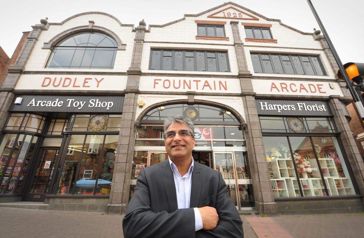 The store was restored to its 1920s glory as part of a Dudley Council scheme in 2015. Councilor Khurshid Ahmed pictured outside the building.
