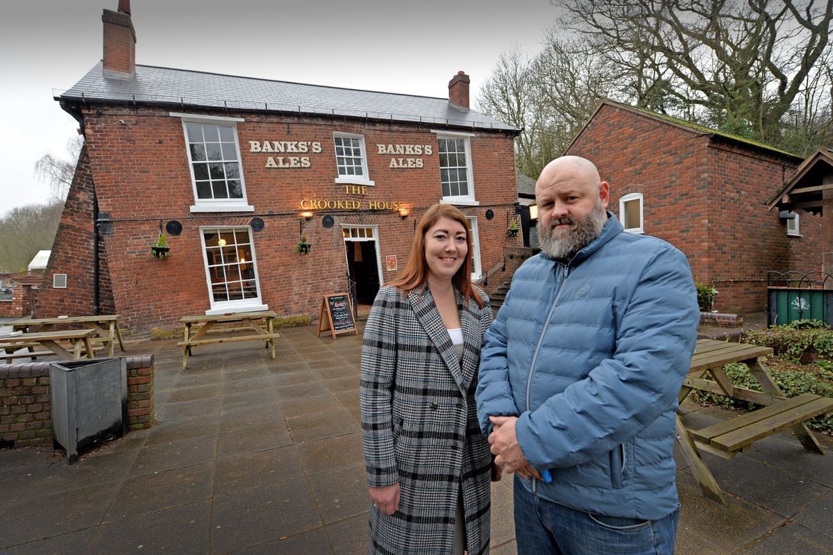 Lee Goodchild and Nicole Ross in front of the Crooked House pub, which has had the roof completely replaced