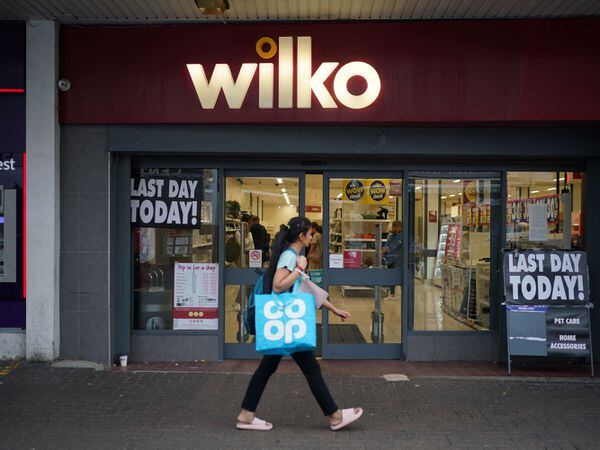 A person passes the Wilko store in Barking, east London