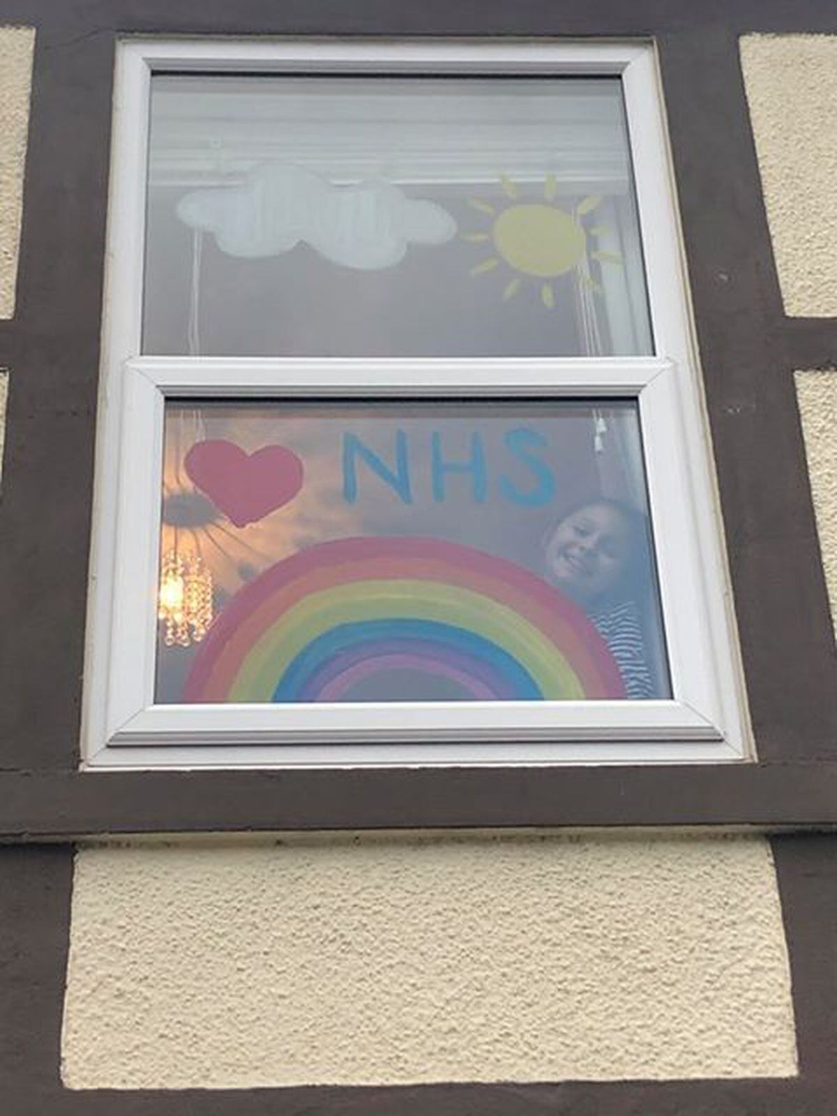 Hannah Hill, aged nine, from Milton Road, Fallings Park, Wolverhampton, with her rainbow design to honour NHS workers