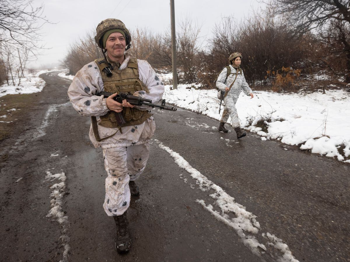 Ukrainian soldiers walks at the line of separation from pro-Russian rebels near Katerinivka, Donetsk region, Ukraine