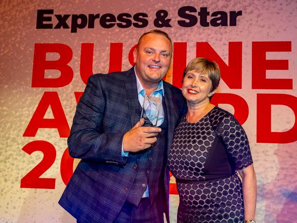 James Lane with his business person of the year award with Jan Jennings from award sponsors Richardson