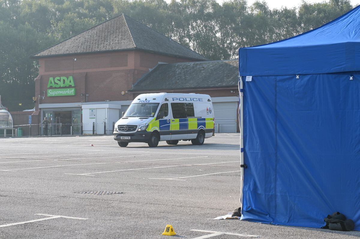 Police outside Asda in Heath Town, Wolverhampton, where a man was stabbed. Photo: SnapperSK