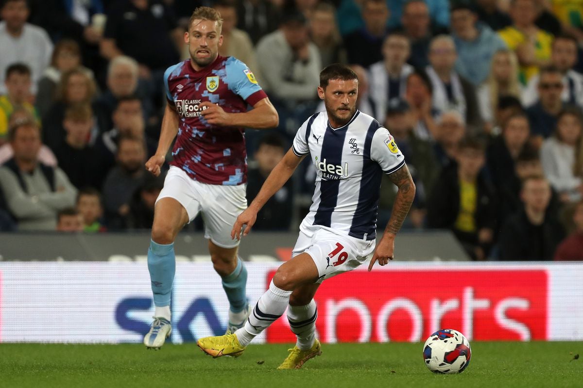 John Swift of West Bromwich Albion and Charlie Taylor of Burnley during the Sky Bet Championship between West Bromwich Albion and Burnley at The Hawthorns on September 3, 2022 in West Bromwich, United Kingdom. (Photo by Adam Fradgley/West Bromwich Albion FC via Getty Images).