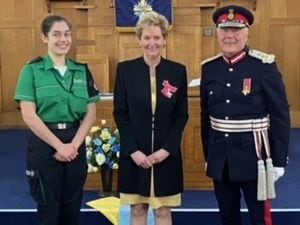 MBE recipient Julie Grainger (centre), founder of Wolverhampton Alz Cafe, is pictured with John Crabtree OBE, Her Majesty's Lord Lieutenant for the West Midlands, and St John Ambulance leading cadet Rebecca Edwards