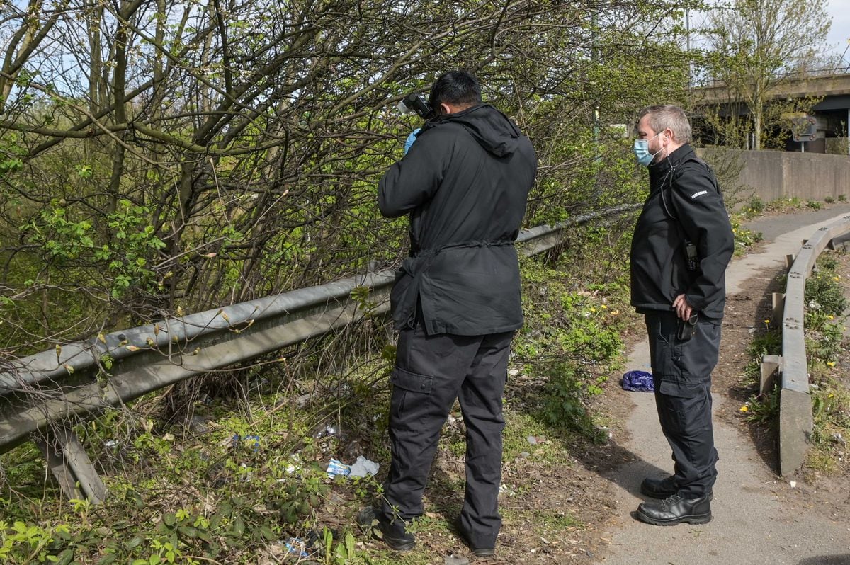 Police at the scene next to Junction 9 of the M6 where human remains were found. Photo: SnapperSK