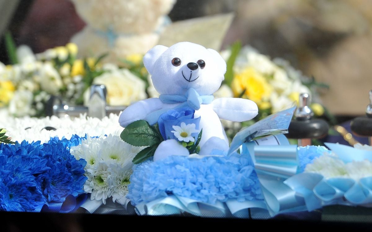 The funeral procession in Brownhills High Street for baby Ciaran Morris