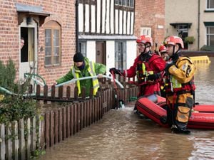 Search and rescue teams check on residents in Bewdley after floodw ater from the River Severn breached the town's flood defences. Photo: Joe Giddens/PA Wire