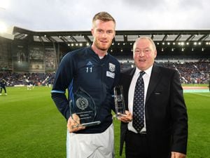 Former West Bromwich Albion player Derek Statham presents trophies to Chris Brunt of West Bromwich Albion (AMA)