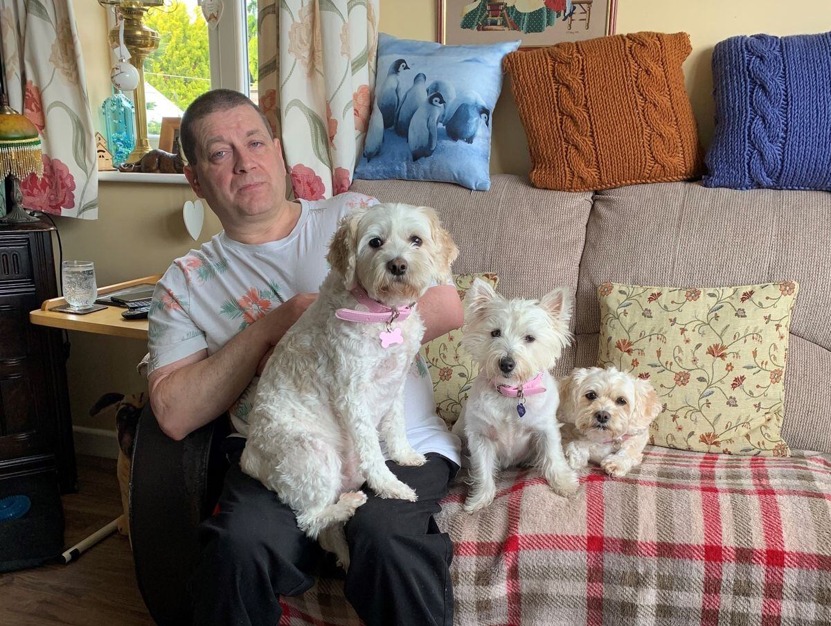 Rob Casey at home with his dogs