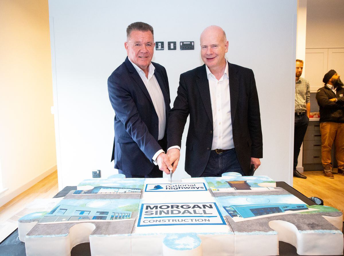 Morgan Sindall Project Director Tony Fitzgerald and National Highways Chief Executive Nick Harris cut the cake marking the completion of the four depots 