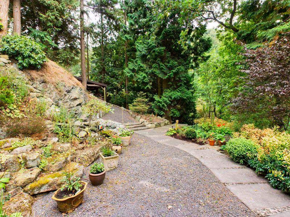 Landscaped grounds surround the house. Photo: Nick Tart Estate Agents/Rightmove