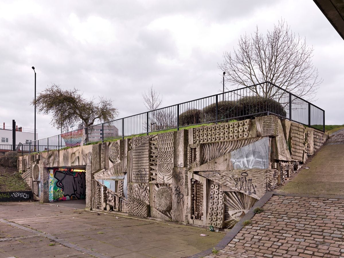 The murals in the pedestrian concourse of Hockley flyover in Birmingham, by sculptor William Mitchell, have been given listed status. (Historic England/ PA)