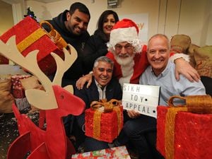 Sikh Toy Appeal founding members Manny Johal, Jaz Sidhu, founding trustee of Promise Dreams Suresh Bawa with Father Christmas and Steve Bull
