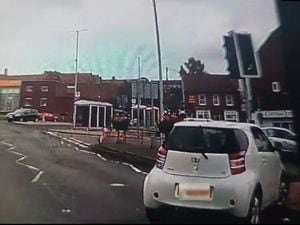 Dashcam footage captured the moment a driver mounted the pavement at a pedestrian crossing in Gornal