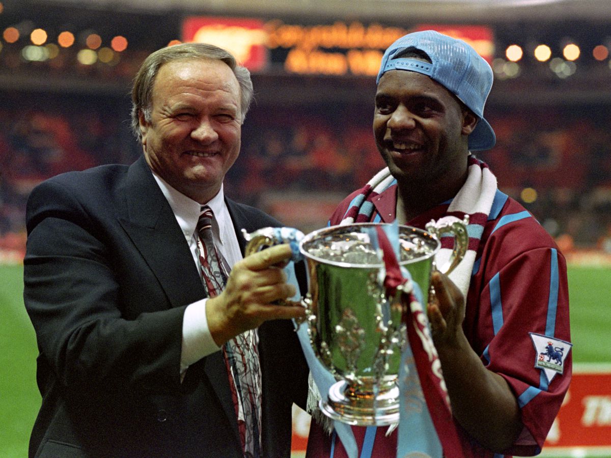 Ron Atkinson and Dalian Atkinson celebrate with the Coca-Cola cup in 1994