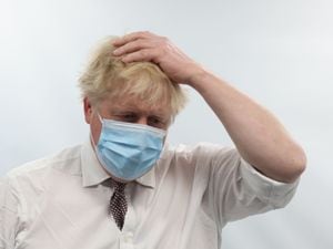 Prime Minister Boris Johnson talks to staff during a visit to the Finchley Memorial Hospital in north London