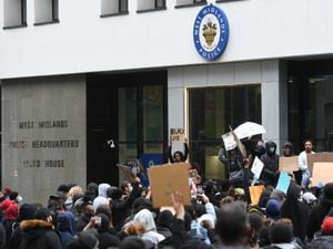 People protesting outside West Midlands Police headquarters Lloyd House during a Black Lives Matter protest rally in Birmingham yesterday