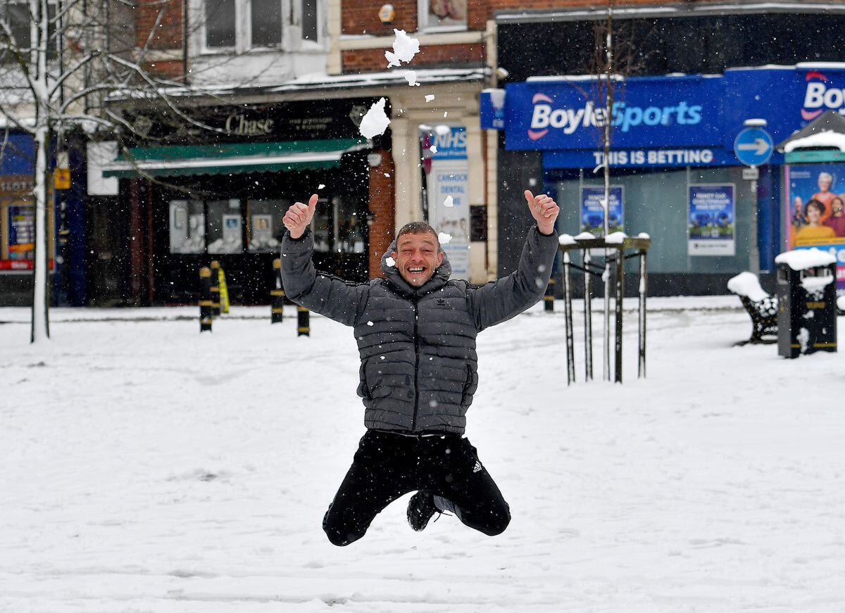 Ricky Podmore has fun in the snow in Cannock town centre