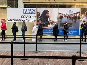 People queue at a Covid-19 vaccination centre at the Westfield shopping centre in Stratford, east London