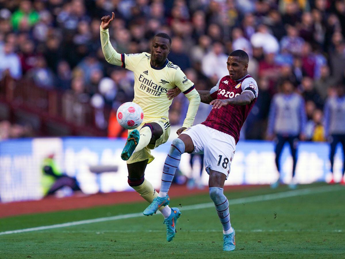 
              
Arsenal's Nicolas Pepe (left) and Aston Villa's Ashley Young (right) battle for the ball during the Premier League match at Villa Park, Birmingham. Picture date: Saturday March 19, 2022. PA Photo. See PA story SOCCER Villa. Photo credit should read: Joe Giddens/PA Wire.


RESTRICTIONS: EDITORIAL USE 
ONLY No use with unauthorised audio, video, data, fixture lists, club/league logos or "live" services. Online in-match use limited to 120 images, no video emulation. No use in betting, games or single club/league/player publications.
            
