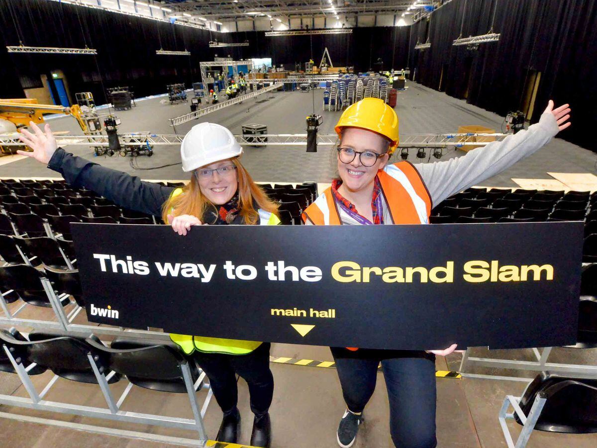 Crissie Rushton and Liz Grimshaw from Wolverhampton Council get ready for the Grand Slam of Darts