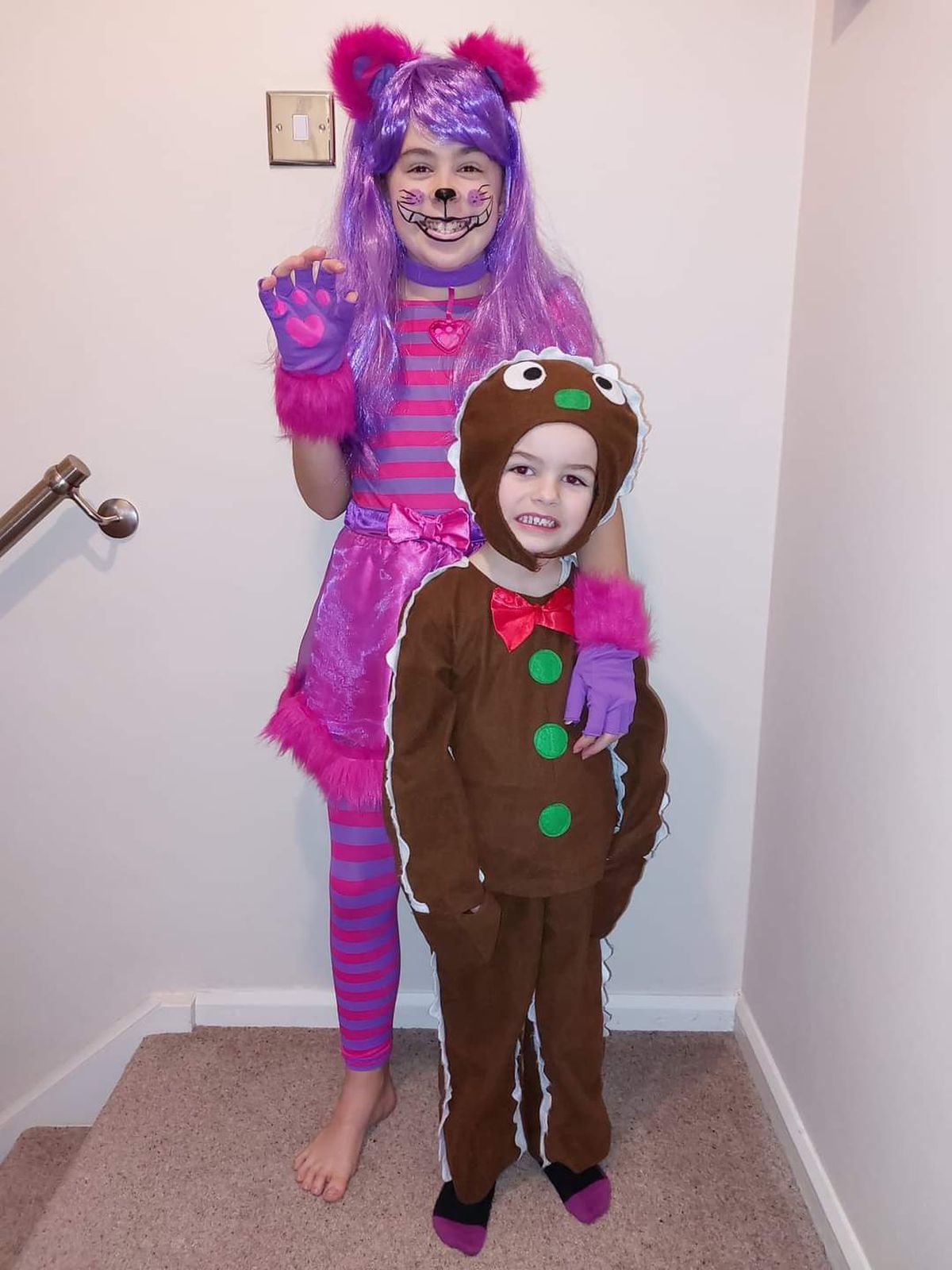 Freya and Ted Thursfield, aged ten and four, as a Cheshire Cat and Gingerbread Man duo.