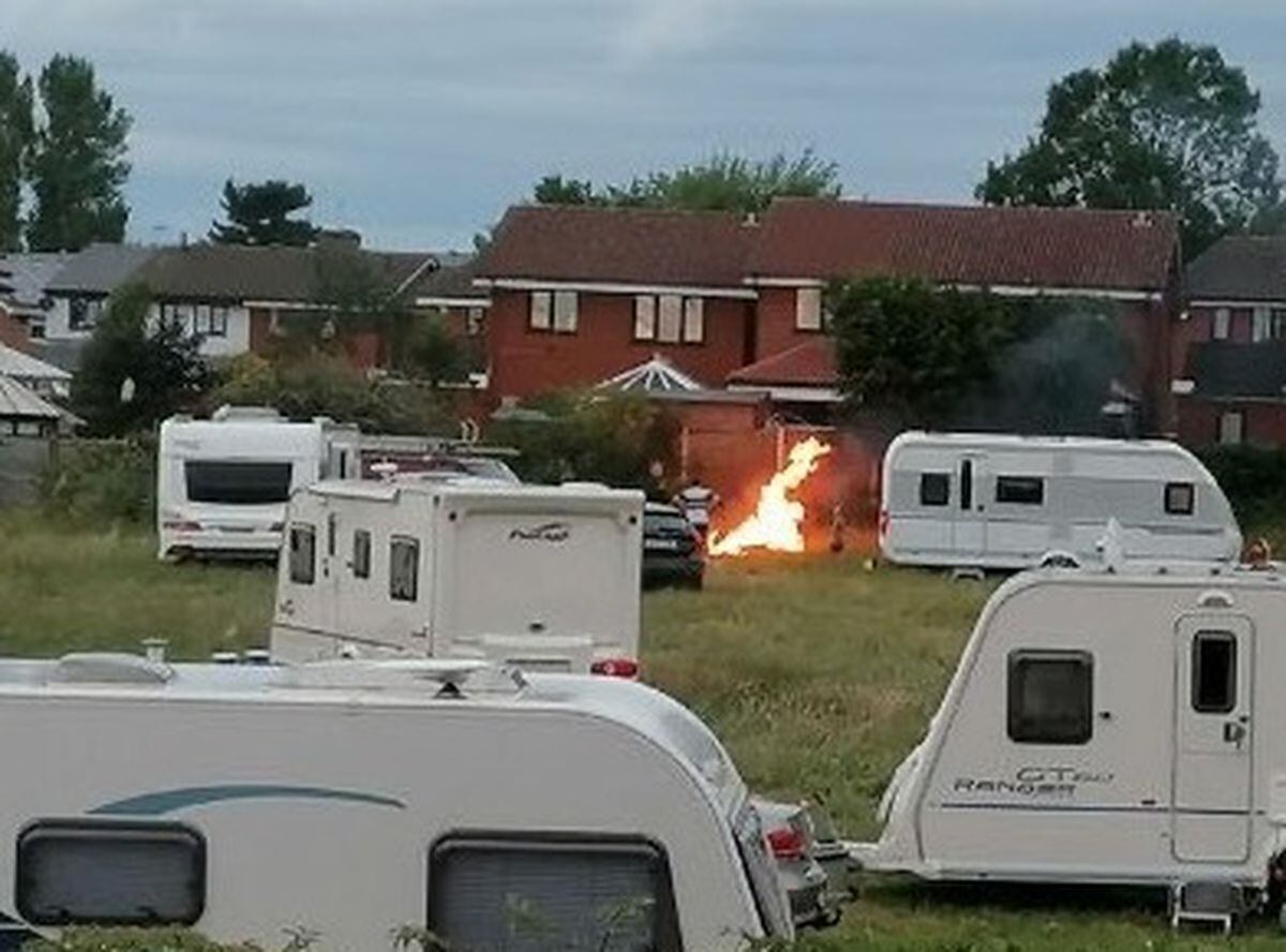 Travellers who had broken into school playing fields in New Invention started a bonfire