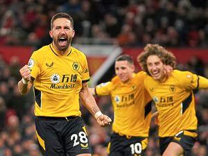 Wolverhampton Wanderers' Joao Moutinho celebrates after scoring his side's first goal during the English Premier League soccer match between Manchester United and Wolverhampton Wanderers at Old Trafford stadium in Manchester, England, Monday, Jan.3, 2022. (AP Photo/Dave Thompson)