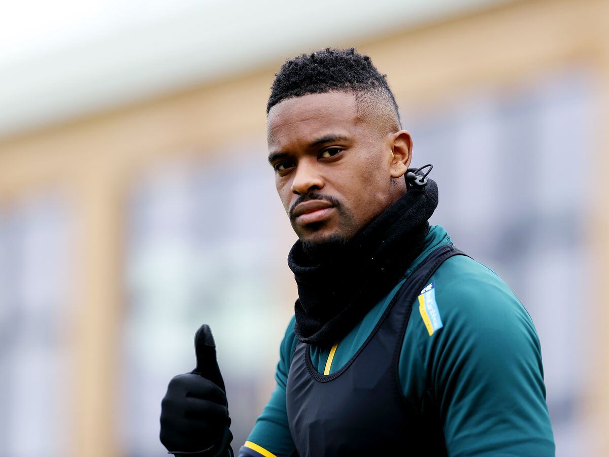 Nelson Semedo of Wolverhampton Wanderers walks out to the pitch ahead of a Wolverhampton Wanderers Training Session at The Sir Jack Hayward Training Ground on January 21, 2022 in Wolverhampton, England. (Photo by Jack Thomas - WWFC/Wolves via Getty Images).