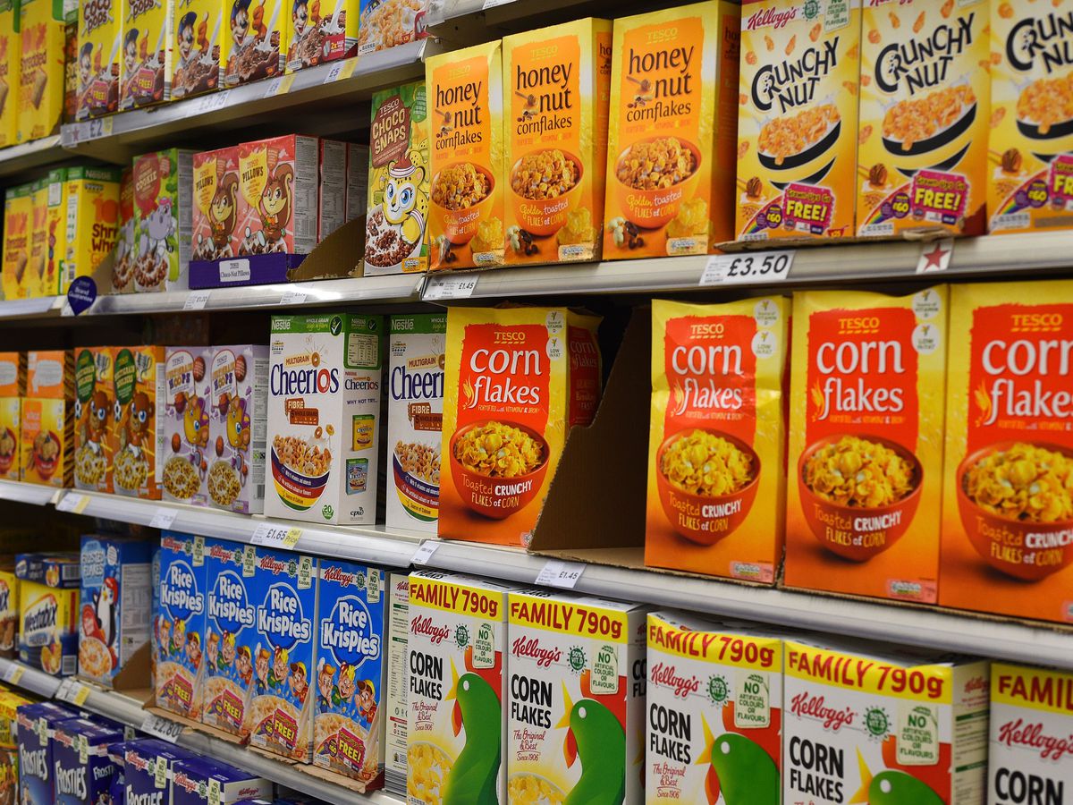 Supermarket shelves displaying breakfast cereals
