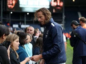  Jonas Olsson poses for selfies and signs autographs for fans after the match at The Hawthorns on September 24, 2022 in West Bromwich, England. (Photo by Adam Fradgley/West Bromwich Albion FC via Getty Images).