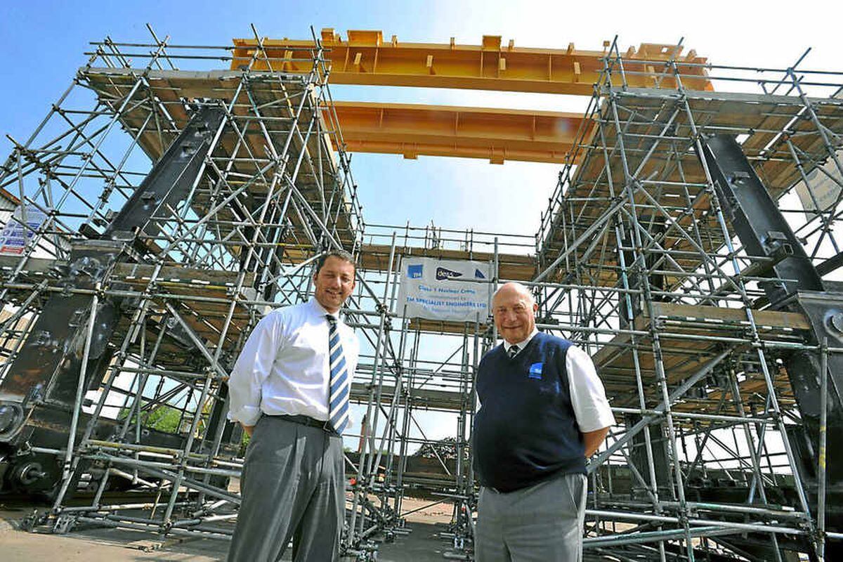 Managing director Robert Holland, right, and sales manager Richard Holland with the colossal crane in Kingswinford