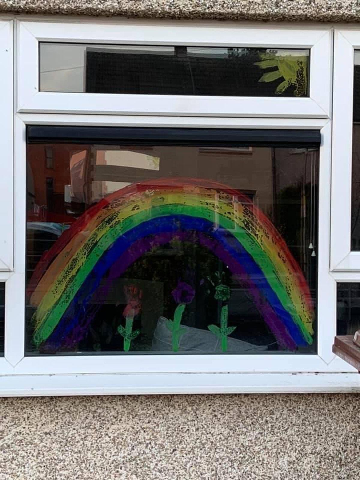Faith Groom, 9, and Aj Groom, 5, from Walsall, with their rainbow creation