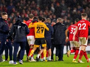 Tempers flare between players following the penalty shoot-out. Picture: Tim Goode/PA Wire.