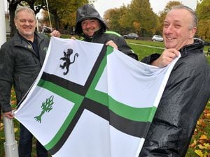 WALSALL   ALAN FOGARASY COPYRIGHT EXPRESS & STAR  26/10/19.About to raise the second of the Bloxwich Flags on the open space off ELmore Road Bloxwich are Lee Brown from local company MARS who sponsored the flag, Gary Flint the chairman of the friend group for Bloxwich parks and Martin Morris from the Bloxwich Flag all braving the very wet weather.