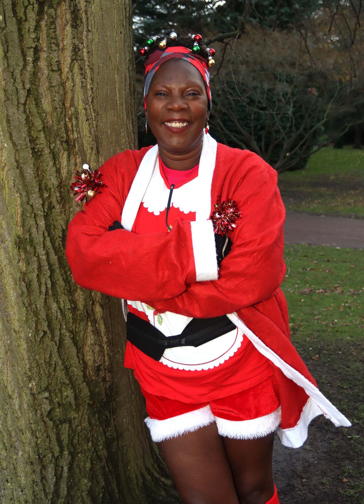 Martha Cummings helped everyone warm up before the Santa Run