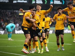  Raul Jimenez of Wolverhampton Wanderers celebrates with Daniel Podence, Max Kilman and teammates  (Photo by Jack Thomas - WWFC/Wolves via Getty Images).