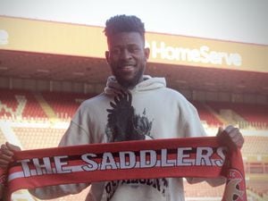 Rollin Menayese after signing his permanent deal (Picture: Walsall FC)