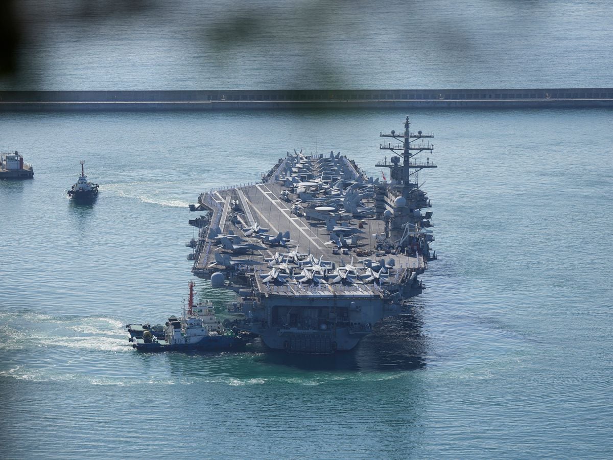 US aircraft carrier USS Ronald Reagan is escorted into Busan Naval Base