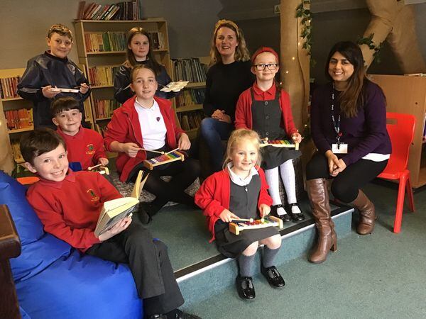 Headteacher Mokshuda Begum (right) and Hayley Tarbet with pupils in the school’s Learning Loft