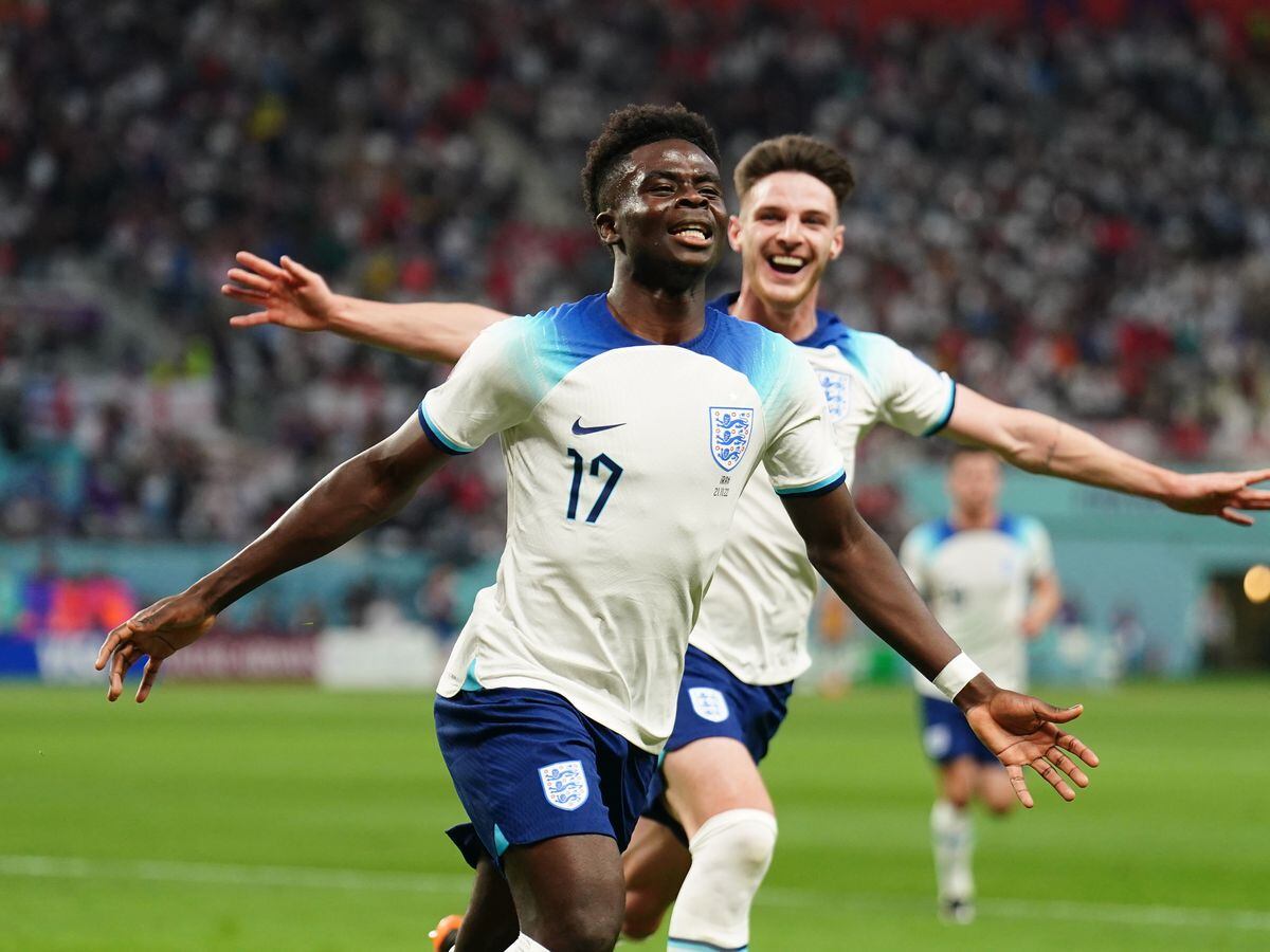 
              
England's Bukayo Saka (left) celebrates scoring their side's second goal of the game during the FIFA World Cup Group B match at the Khalifa International Stadium, Doha. Picture date: Monday November 21, 2022. PA Photo. See PA story WORLDCUP England. Photo credit should read: Mike Egerton/PA Wire.


RESTRICTIONS: Use subject to restrictions. Editorial use 
only, no commercial use without prior consent from rights holder.
            
