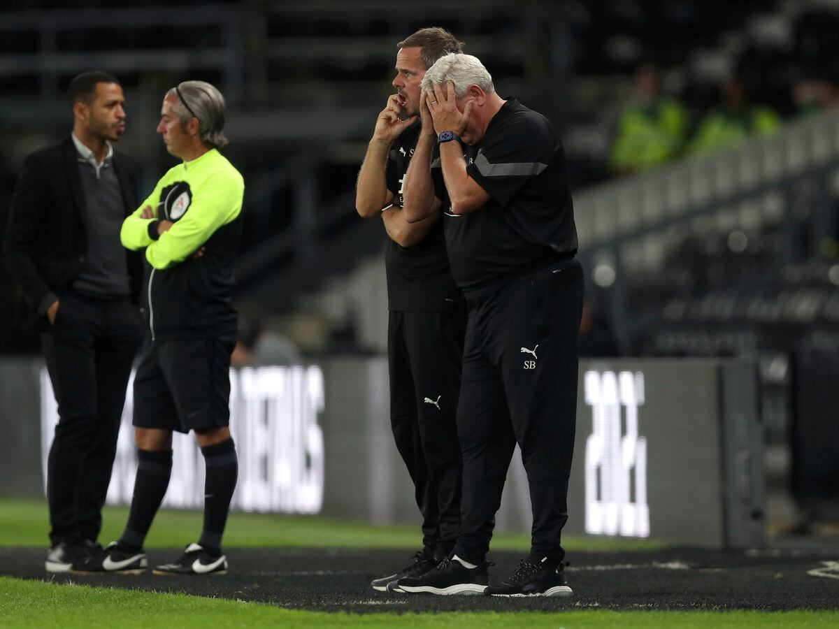 Steve Bruce reacts and puts his head in his hands during the Carabao Cup Second Round match between Derby County and West Bromwich Albion at Pride Park Stadium on August 23, 2022 in Derby, England. (Photo by Adam Fradgley/West Bromwich Albion FC via Getty Images).