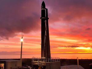 Rocket Lab's Electron rocket waits on the launch pad in New Zealand