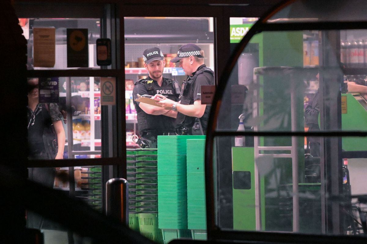Police officers in the Asda supermarket. Photo: SnapperSK