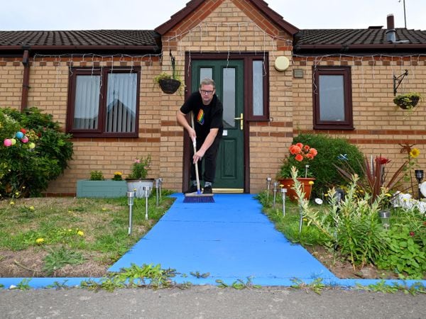 Paul Ryder, who is fed up after being told he has to paint his blue path grey