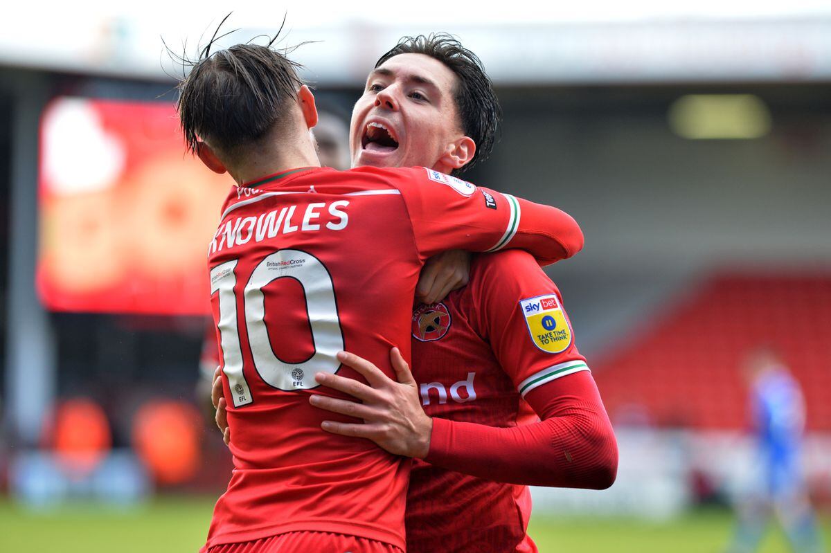 Issac Hutchinson celebrates with Tom Knowles