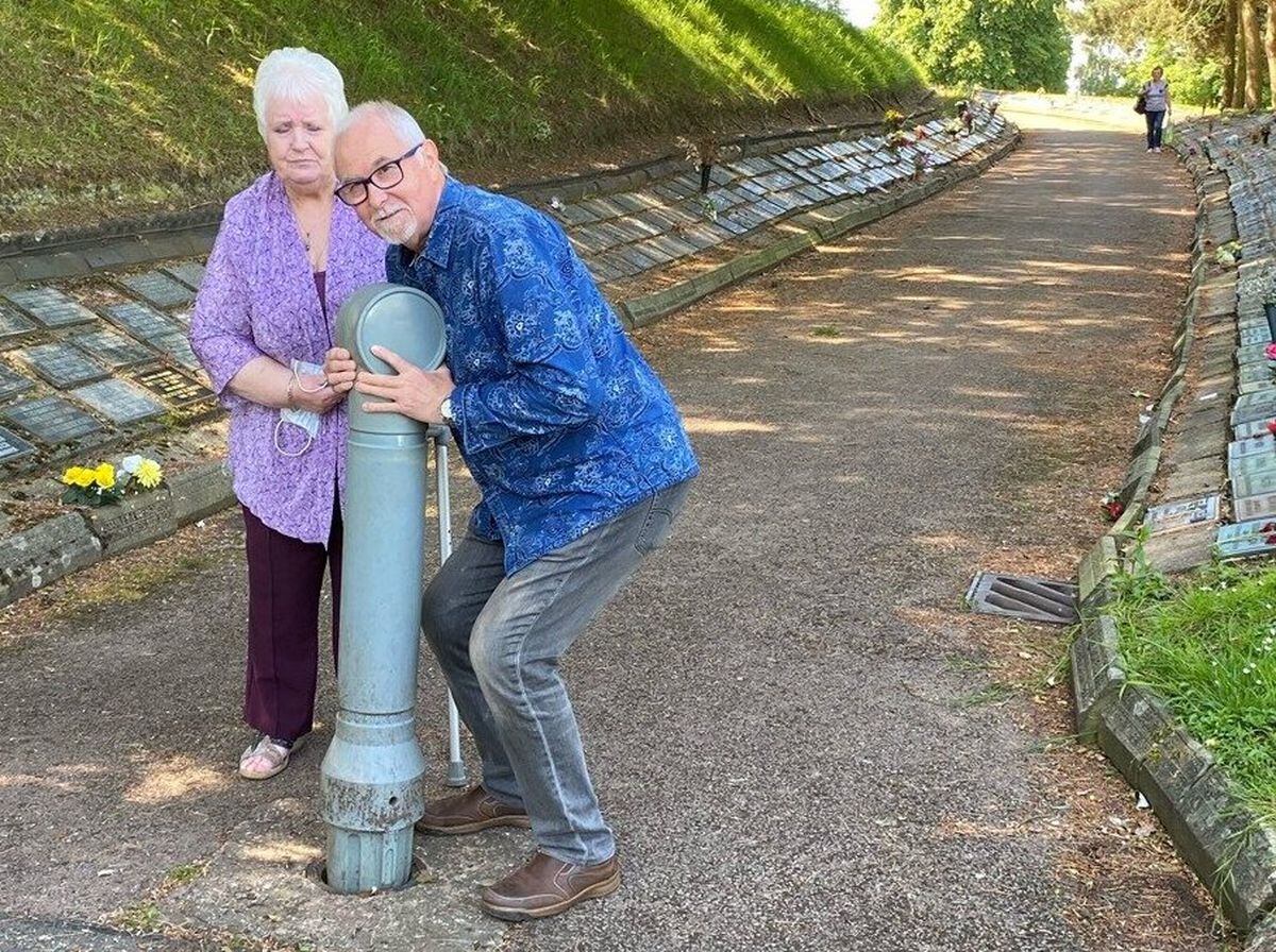 Jean Copeland and former councillor Alan Butt with the bollard at Bushbury Cemetery 