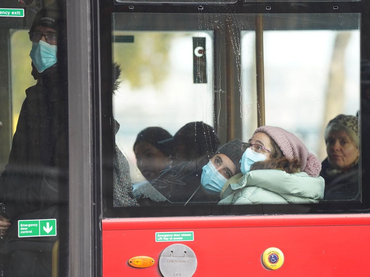 Masked passengers on a bus