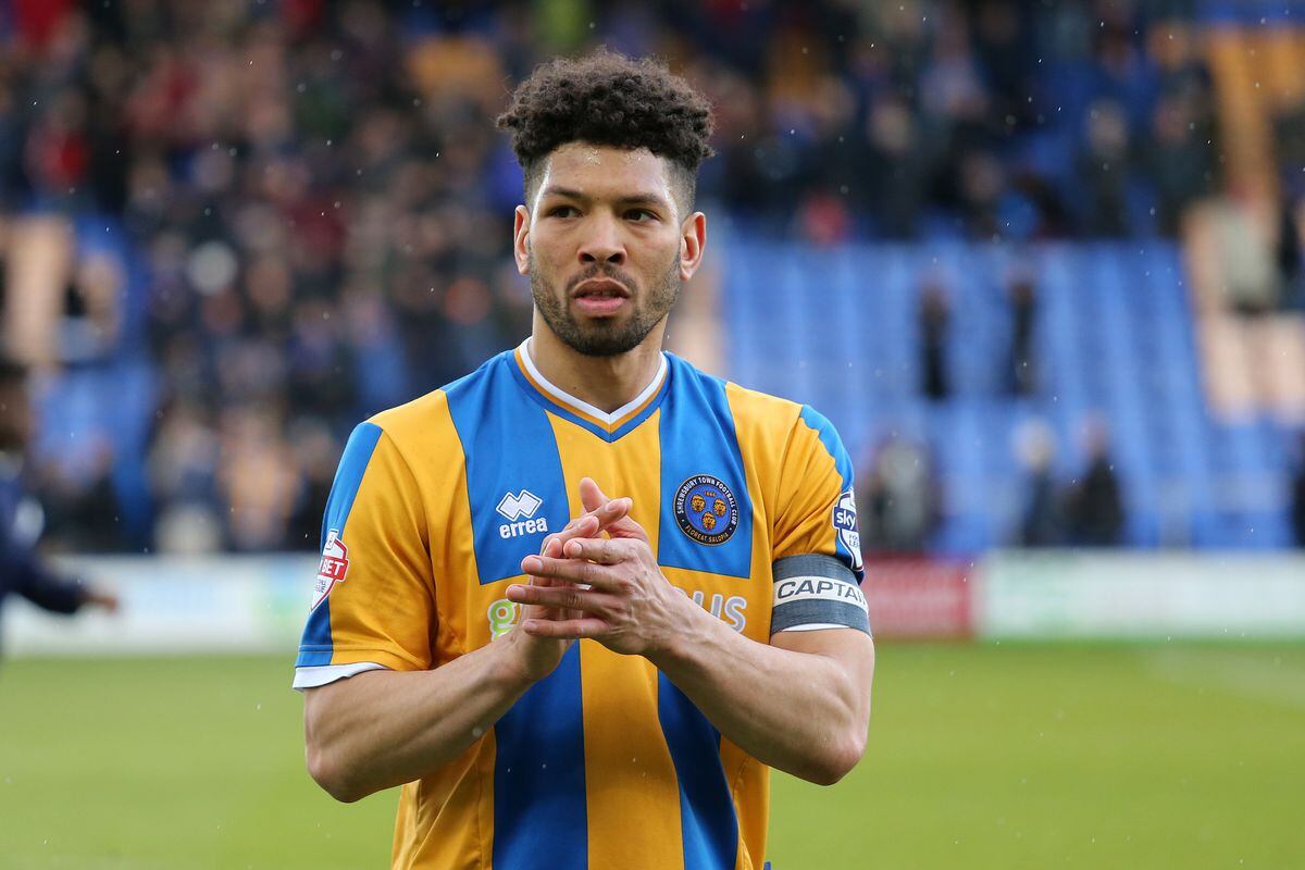 Nat Knight-Percival of Shrewsbury Town applauds the fans as he walks off (AMA)